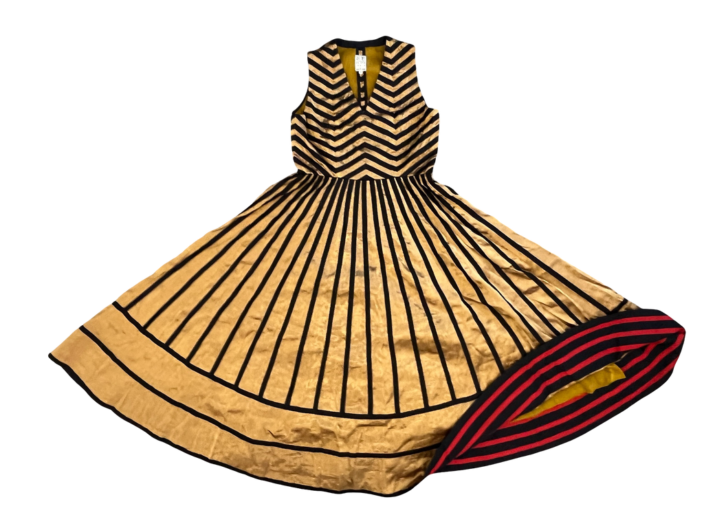 Decorative fan with black and gold design on a white background